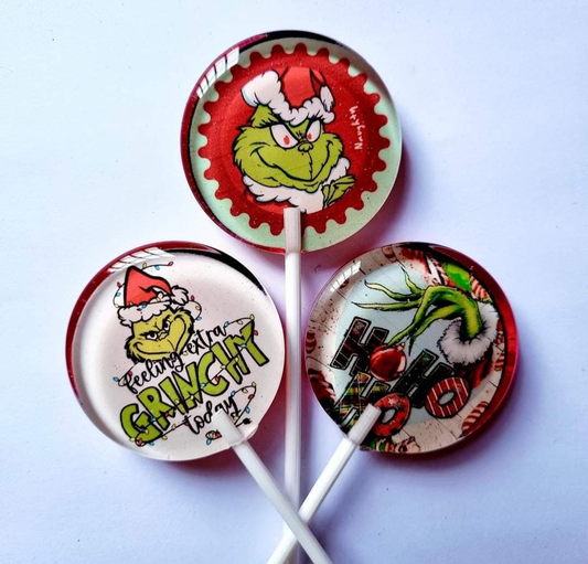 Three example Grinch lollipop designs; sold individually